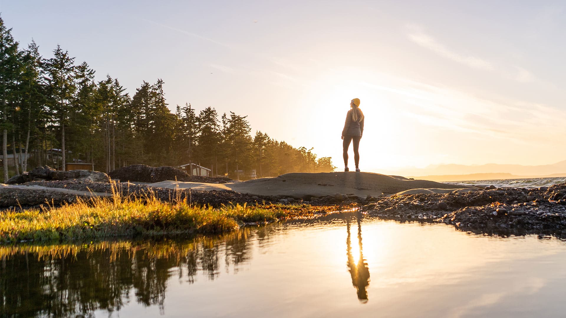 Woman Exploring the Beach at Sunrise